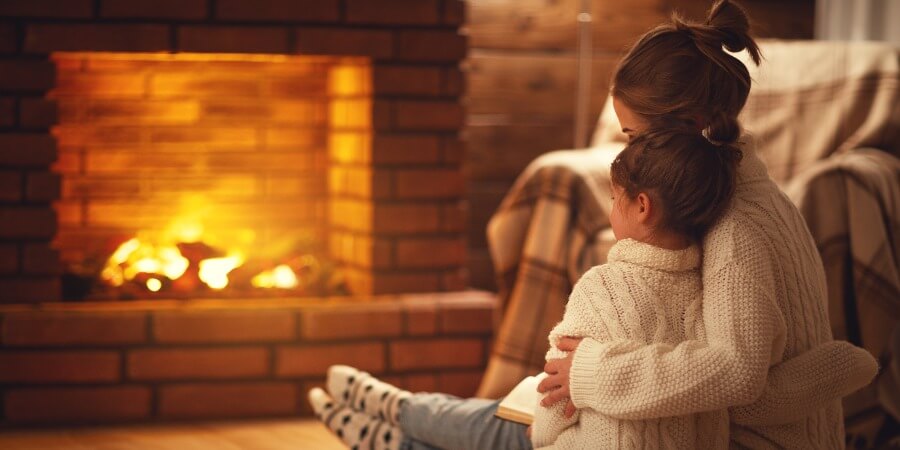 Mother Child In Front Of Fireplace